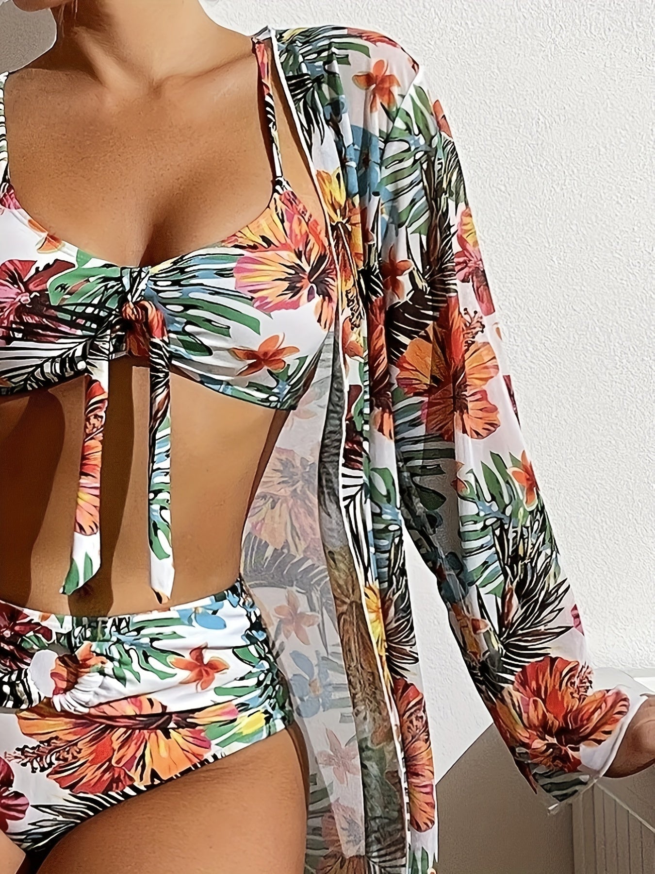 Stevvex Tropical Bloom 3-piece swimsuit set with high waist floral bikini, crew neck top, and long sleeve cover-up, perfect for summer.