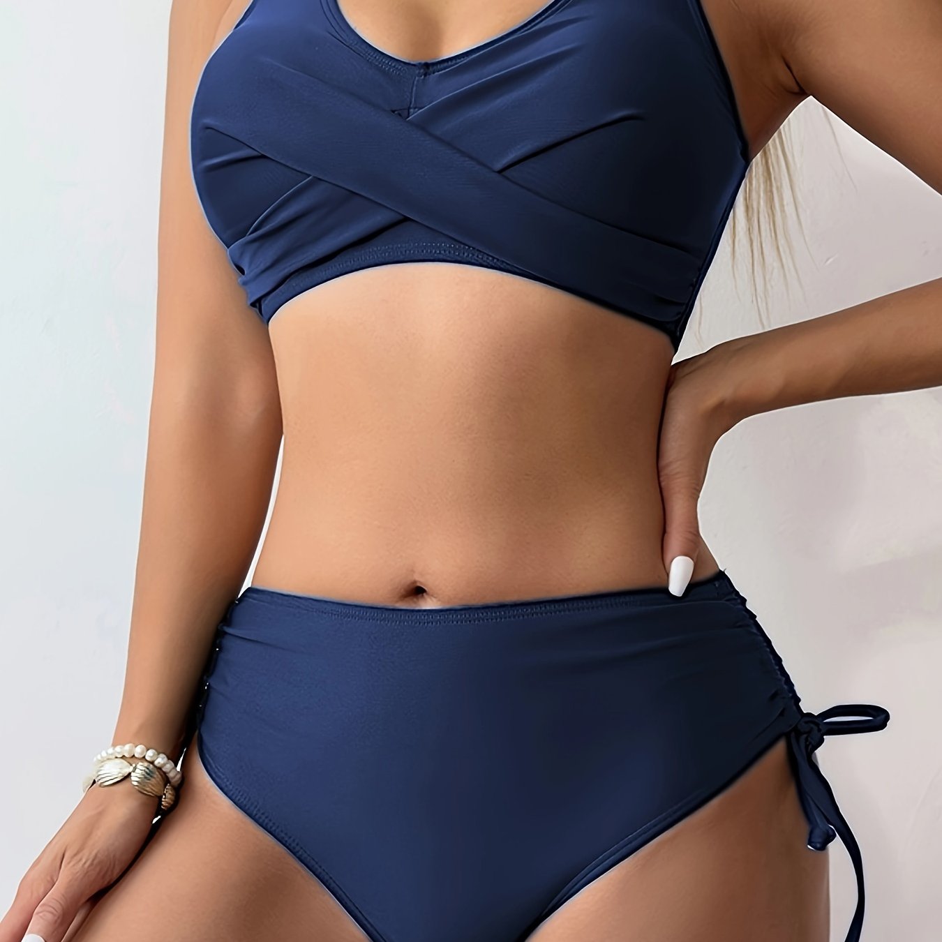Stevvex bikini set featuring twist front V-neck top and high waist bottoms in solid color, perfect for beach and pool days.