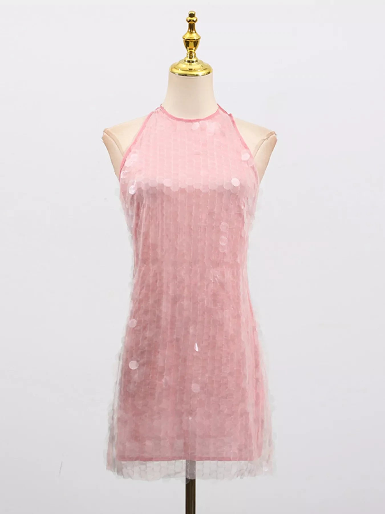 Sequin halter neck mini dress by Shopiebay, featuring sparkling sequins and a stylish halter neckline, perfect for evening wear.