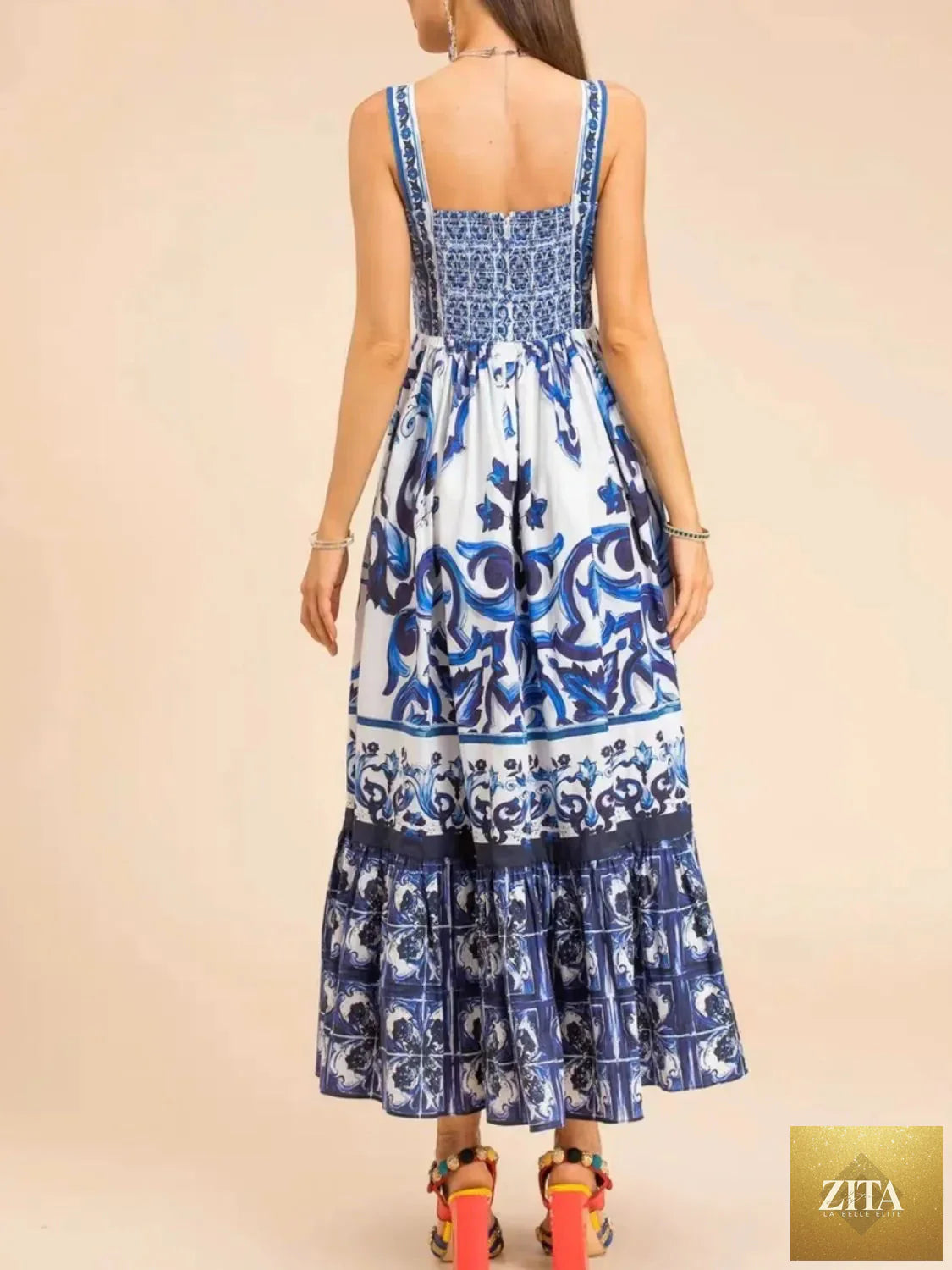 Smocked printed wide strap dress by Shopiebay featuring a flowy silhouette and vibrant floral pattern.