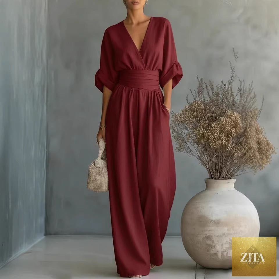 Women's V-neck wide-leg jumpsuit by MERIDGE featuring high waist, pleated design, perfect for elegant, casual or formal occasions.