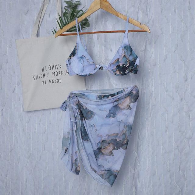 Stevvex 3-piece women's bikini set with high-cut swimsuit, halter top, wrap skirt, lace-up strings, backless design, and triangle cut.