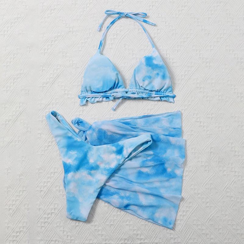 Stevvex 3-piece women's bikini set featuring high-cut swimsuit, halter top, wrap skirt, lace-up details, and backless design.