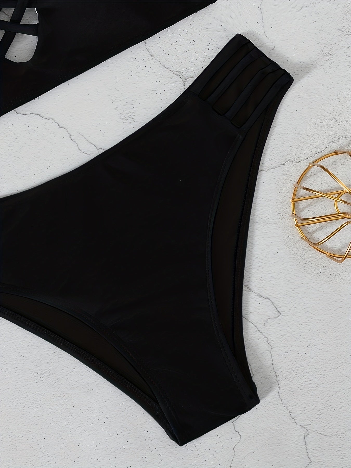 Stevvex Noir Allure criss cross bikini set for women with high waist, hollow out design, buckle detail, and adjustable spaghetti straps.
