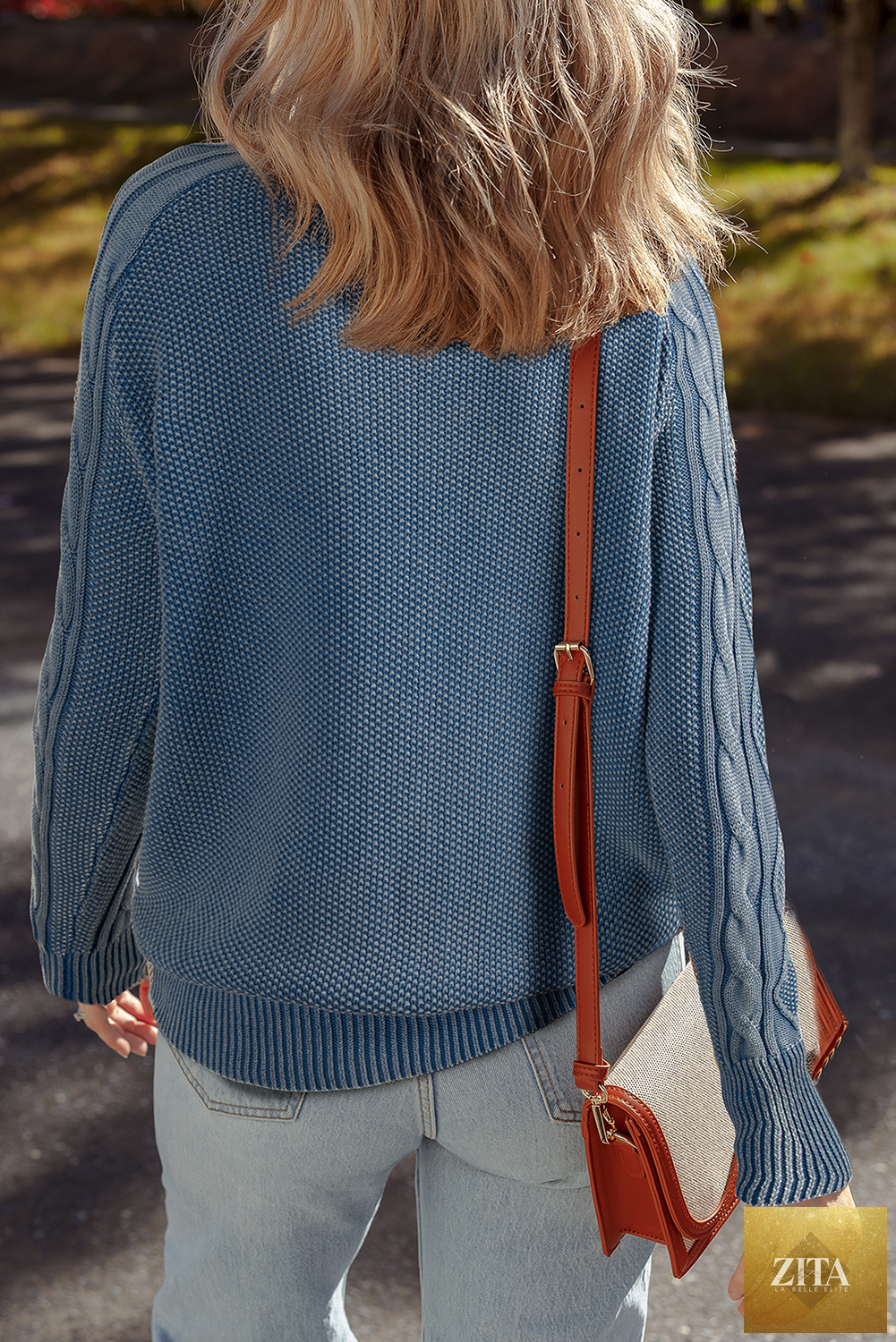 Blue contrast cable knit sleeve casual sweater from Unique Oils, featuring a cozy knit design and relaxed fit.
