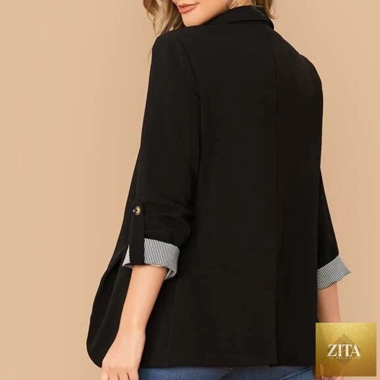 SITRA blazer with lapel collar, roll-tab sleeves, tailored fit, in a classic design, shown on a hanger.