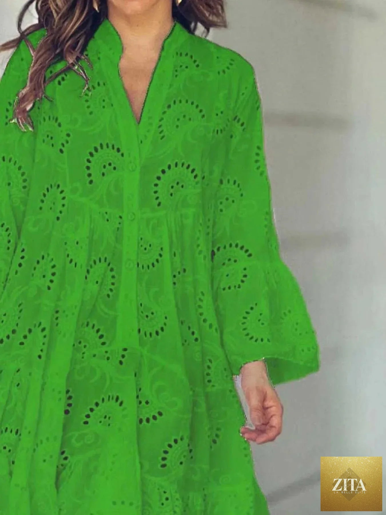 Eyelet ruffled hem tiered dress by Shopiebay featuring layered fabric, eyelet details, and a flowy, feminine silhouette.