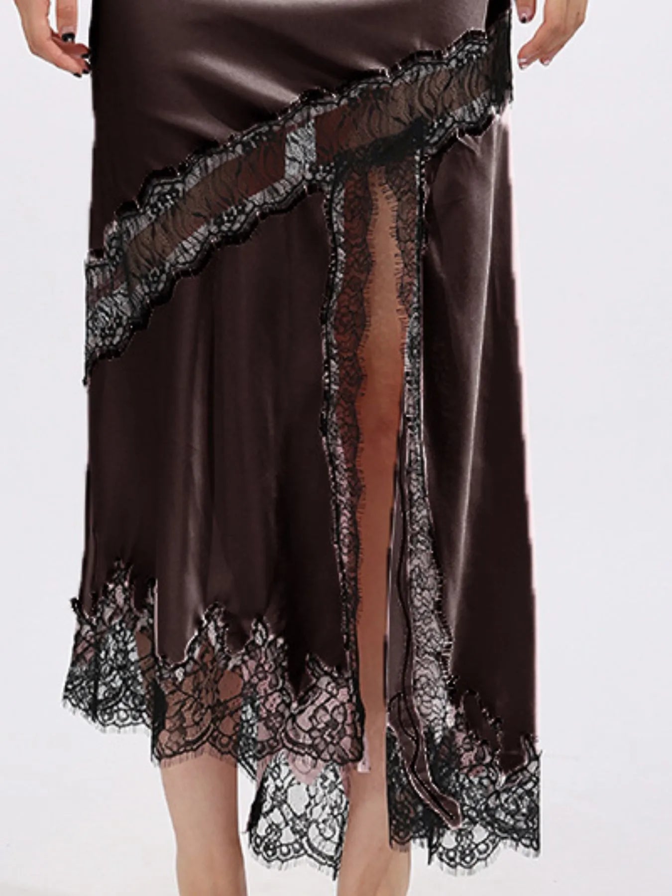 Lace trim asymmetrical midi skirt by The Fashion Celestial featuring a flowing silhouette and elegant detailing.