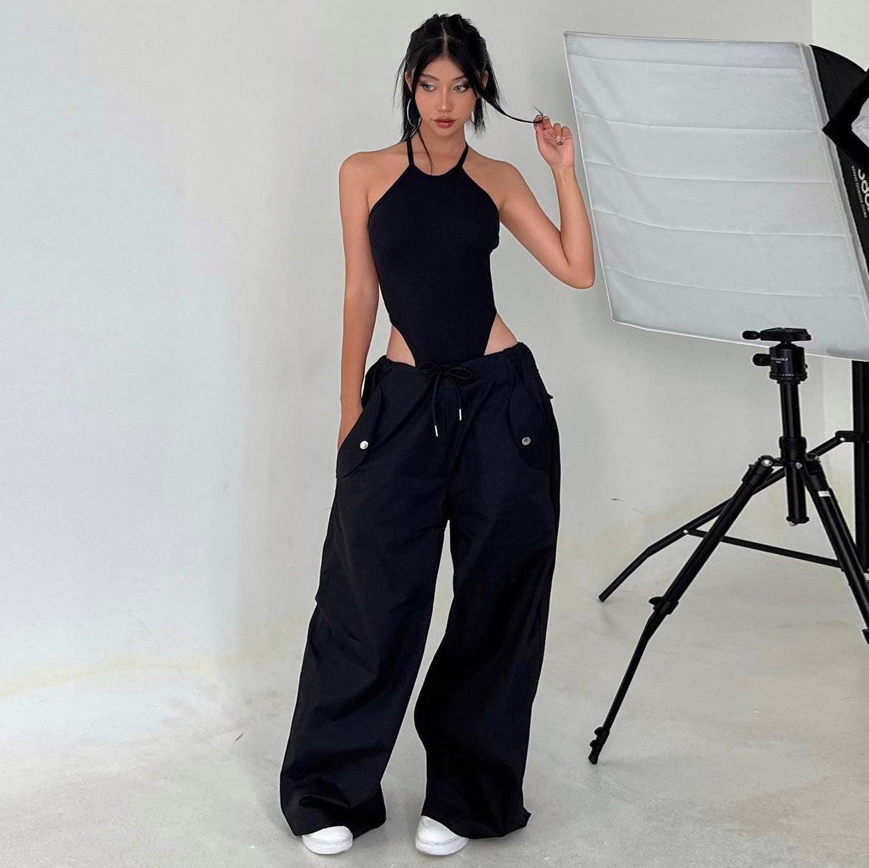Women's high-waist lace-up cargo pants by FitiqueFit, loose fit straight-leg casual trousers with lace-up detail and practical pockets.