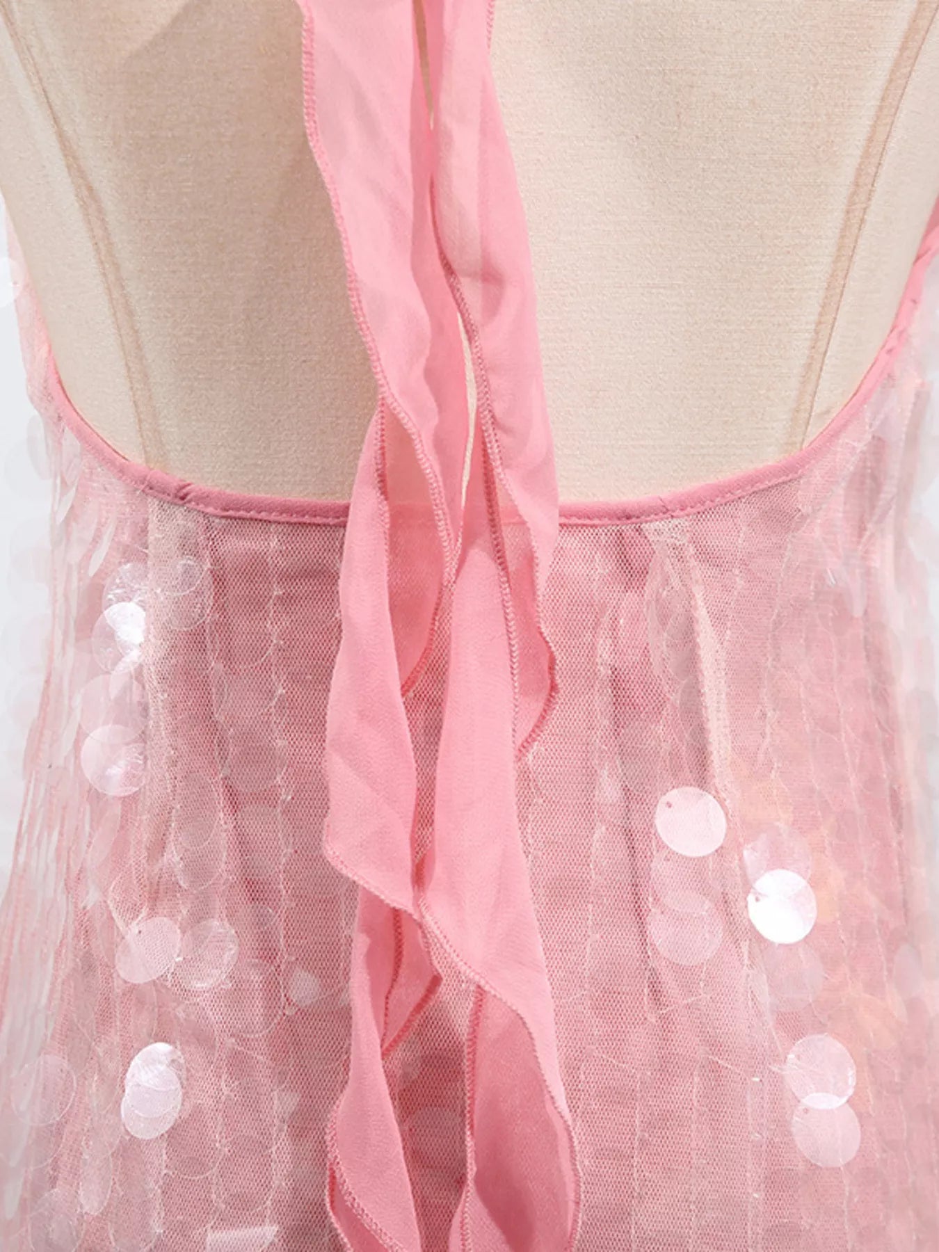 Sequin halter neck mini dress by Shopiebay featuring shiny sequins and a stylish halter neckline, perfect for evening wear.