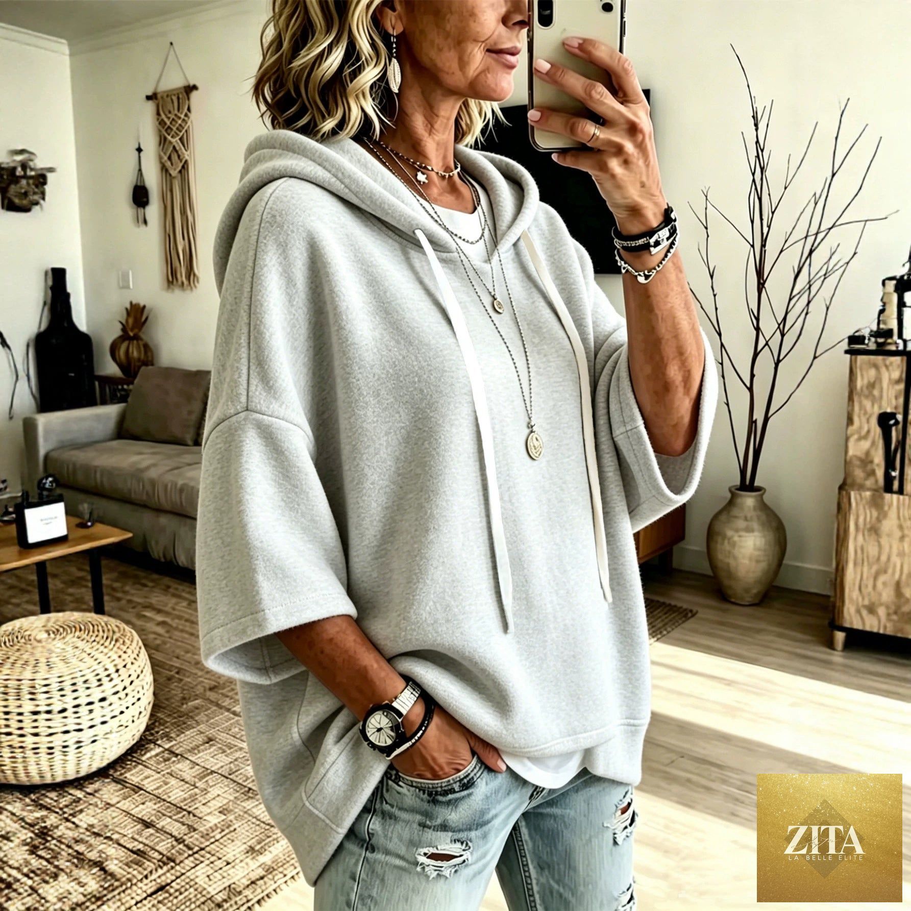 Women's oversized batwing sleeve hoodie by FitiqueFit, loose fleece pullover with relaxed fit and wide sleeve design.