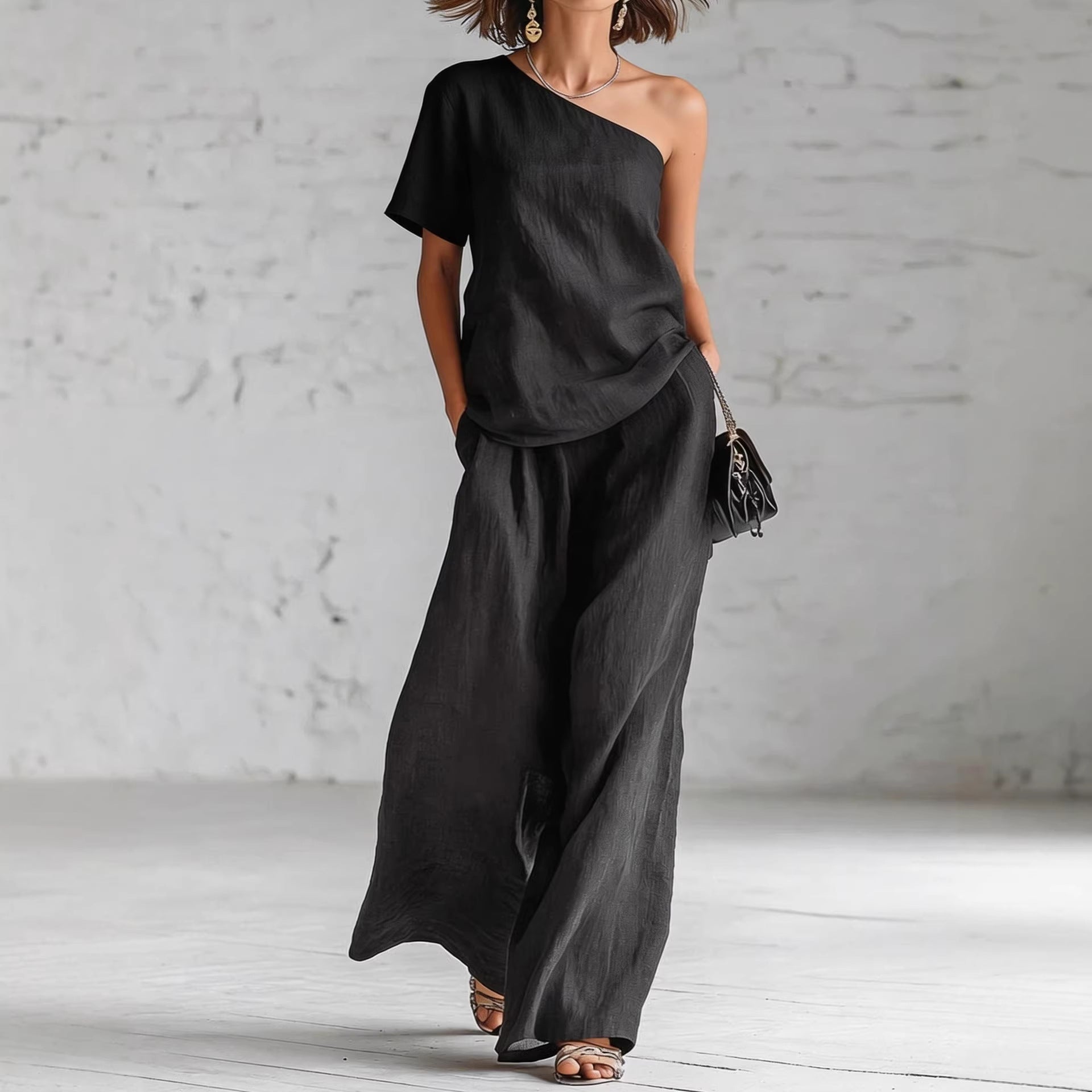 Women's casual FitiqueFit wide-leg pants and matching three-quarter sleeve top set, styled for a relaxed, chic look.