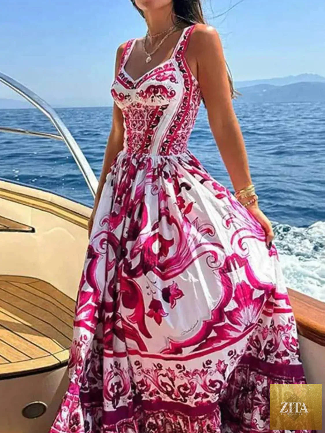 Smocked printed wide strap dress by Shopiebay featuring a flowy silhouette and vibrant floral pattern.
