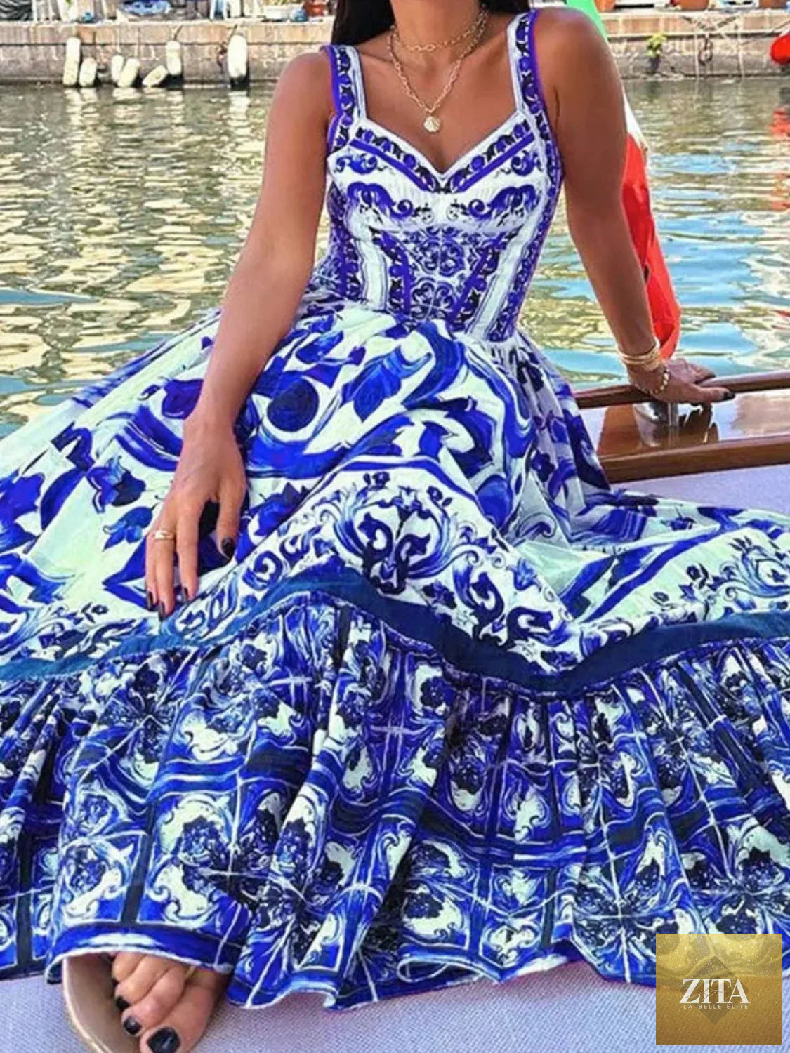 Smocked printed wide strap dress from Shopiebay featuring a flowy design and colorful floral pattern on lightweight fabric.