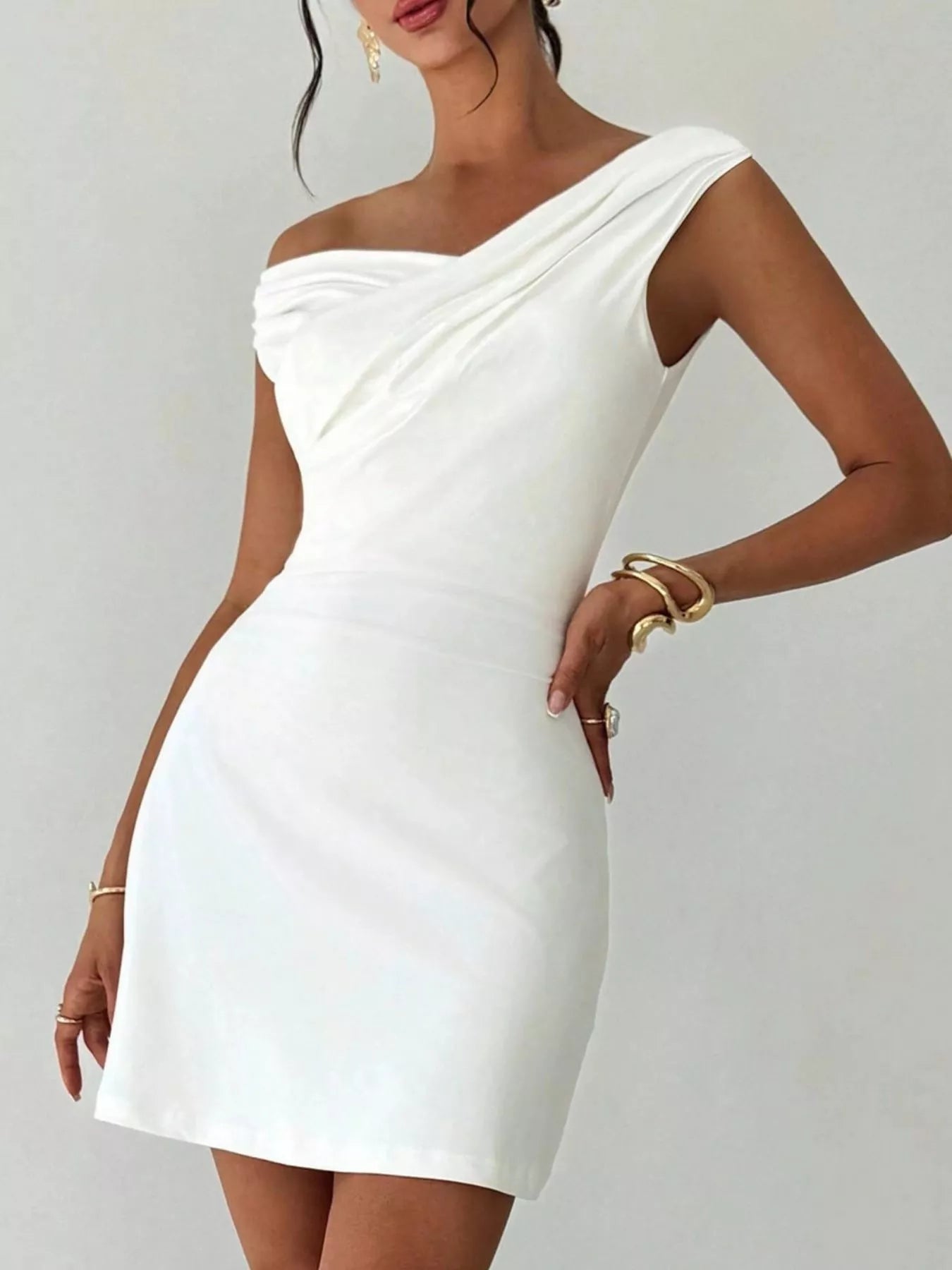 Elegant off-shoulder draped mini dress by Shopiebay featuring flowy fabric and a stylish neckline, perfect for chic occasions.
