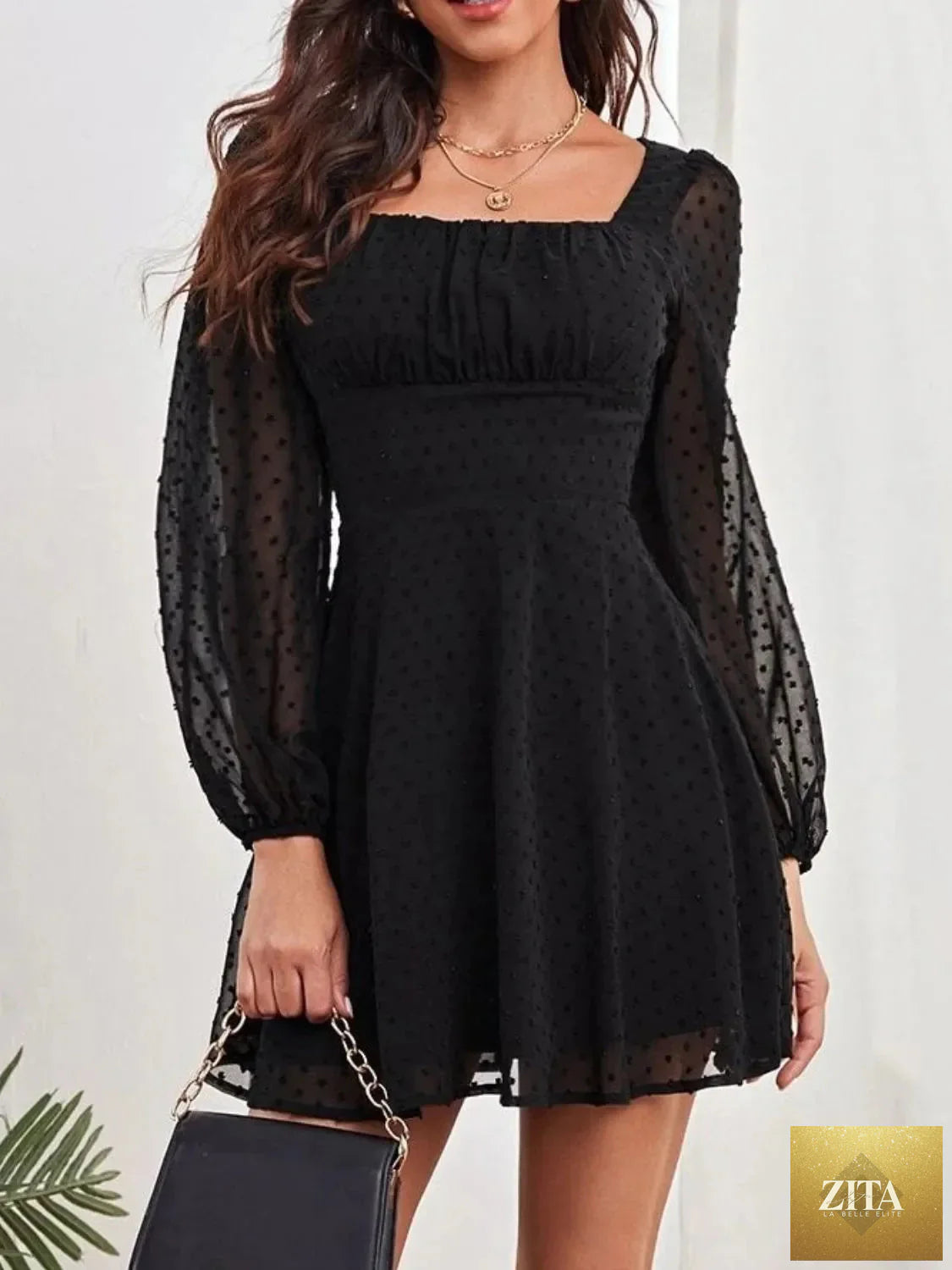 Swiss Dot long sleeve mini dress by Shopiebay, featuring a feminine silhouette and delicate dot pattern, perfect for casual or dressy occasions.