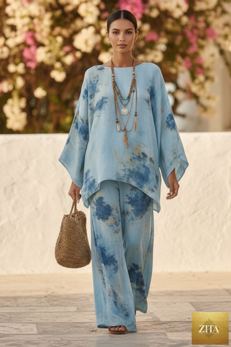 Floral print bamboo linen two-piece set with wide-leg pants by MERIDGE, featuring a matching top and flowy bottoms.