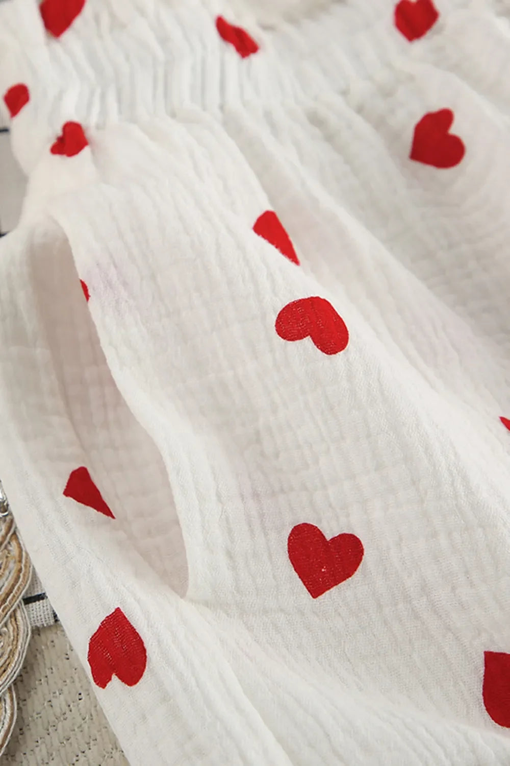 Basic Bae heart-collared neck button-down top and shorts set, featuring a stylish and casual matching outfit for warm weather.