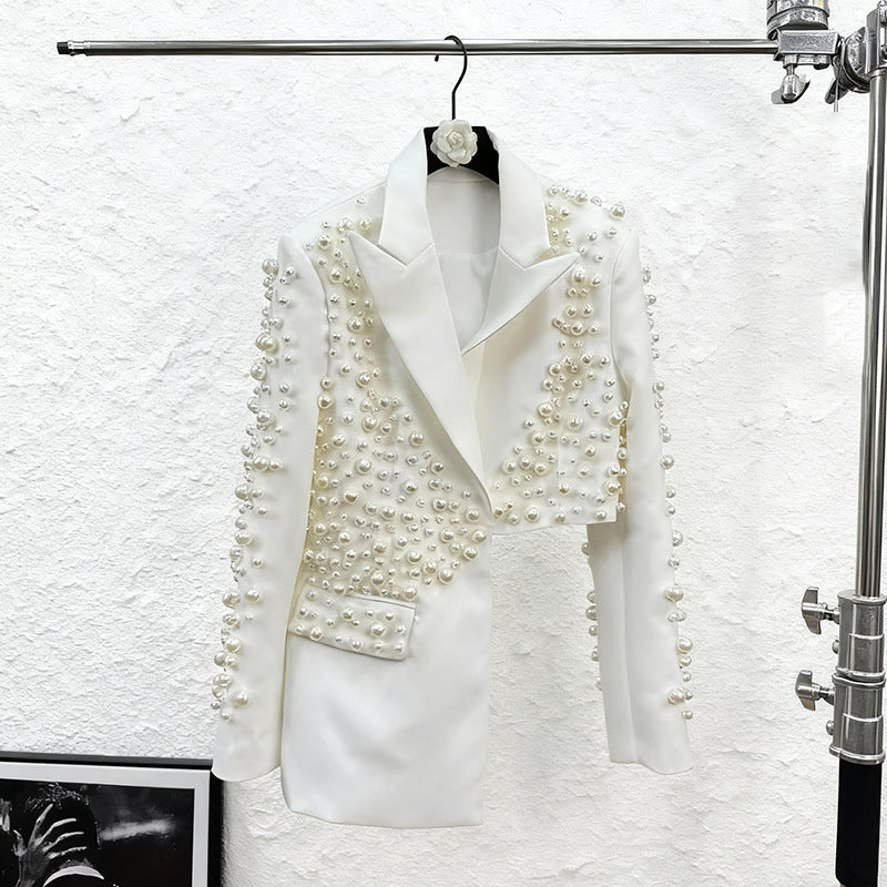 Women's beaded blazer and skirt set by The Fashion Celestial, featuring a deep V-neck and intricate heavy bead detailing.