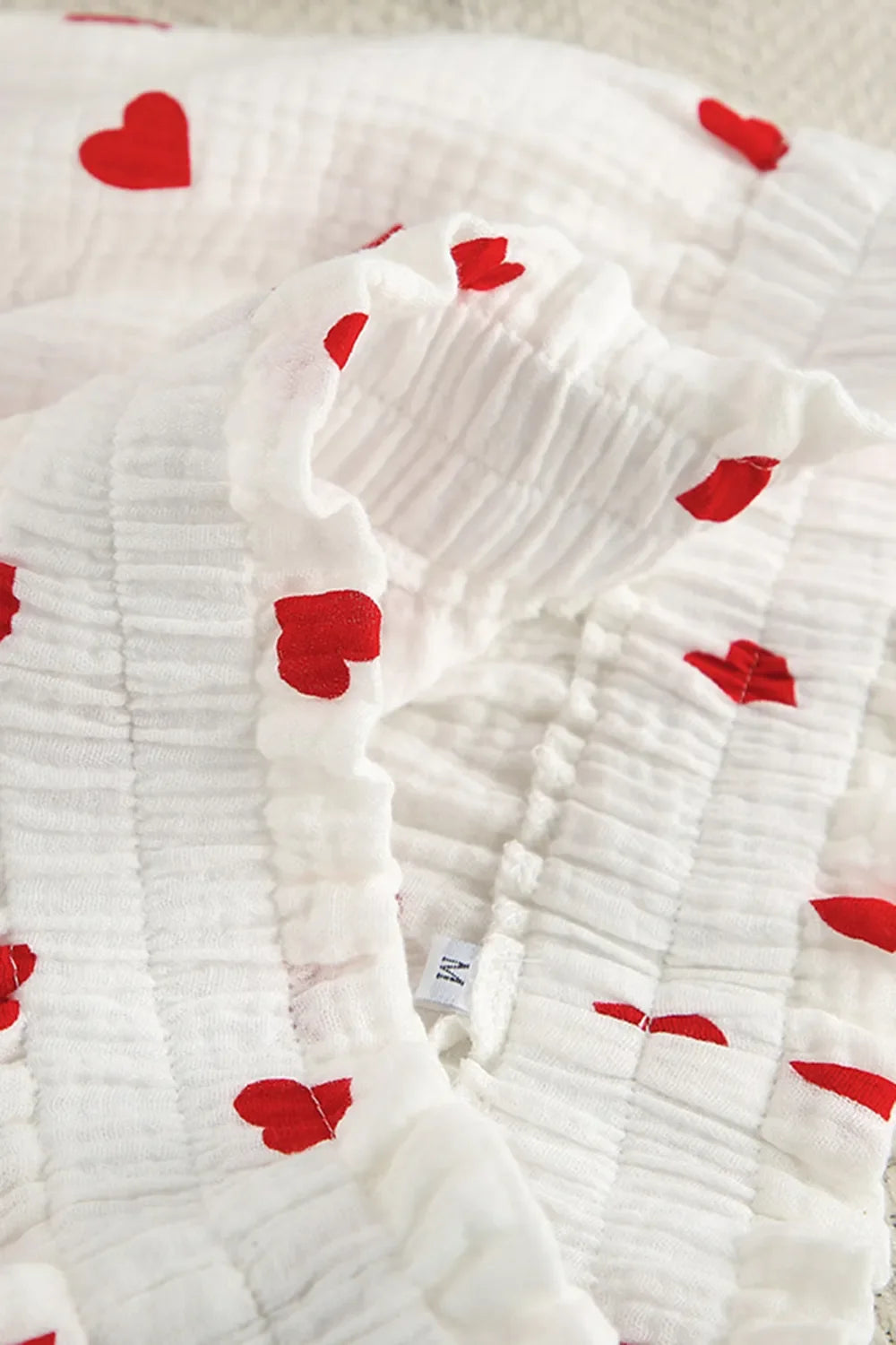 Basic Bae heart collared neck button-down top and shorts set, featuring a cute, casual design with a heart detail and relaxed fit.