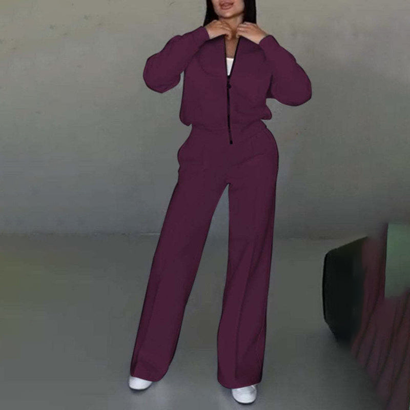 Women’s casual FitiqueFit 2-piece zip-up sweatsuit set with a jacket and wide-leg sweatpants, shown in a relaxed indoor setting.