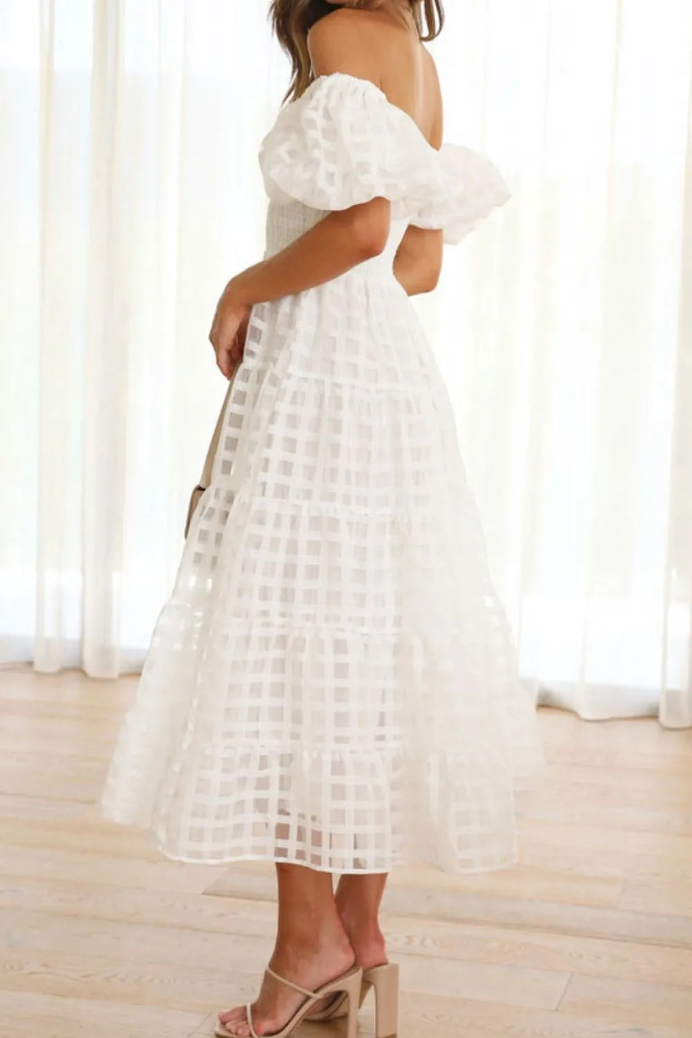 Off shoulder short puff sleeve midi dress from Shopiebay, featuring a stylish design with a fitted bodice and flowing skirt.