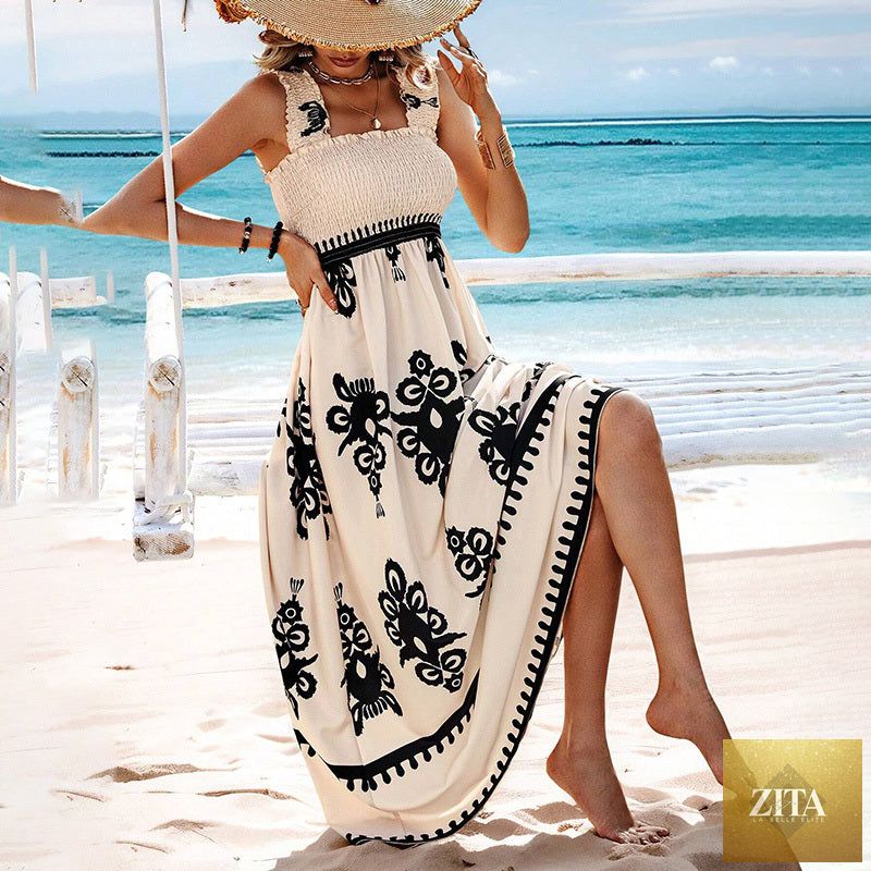 Women's printed maxi dress by MERIDGE featuring wide straps, smocked bodice, and tassel waist, flowing and stylish for summer wear.