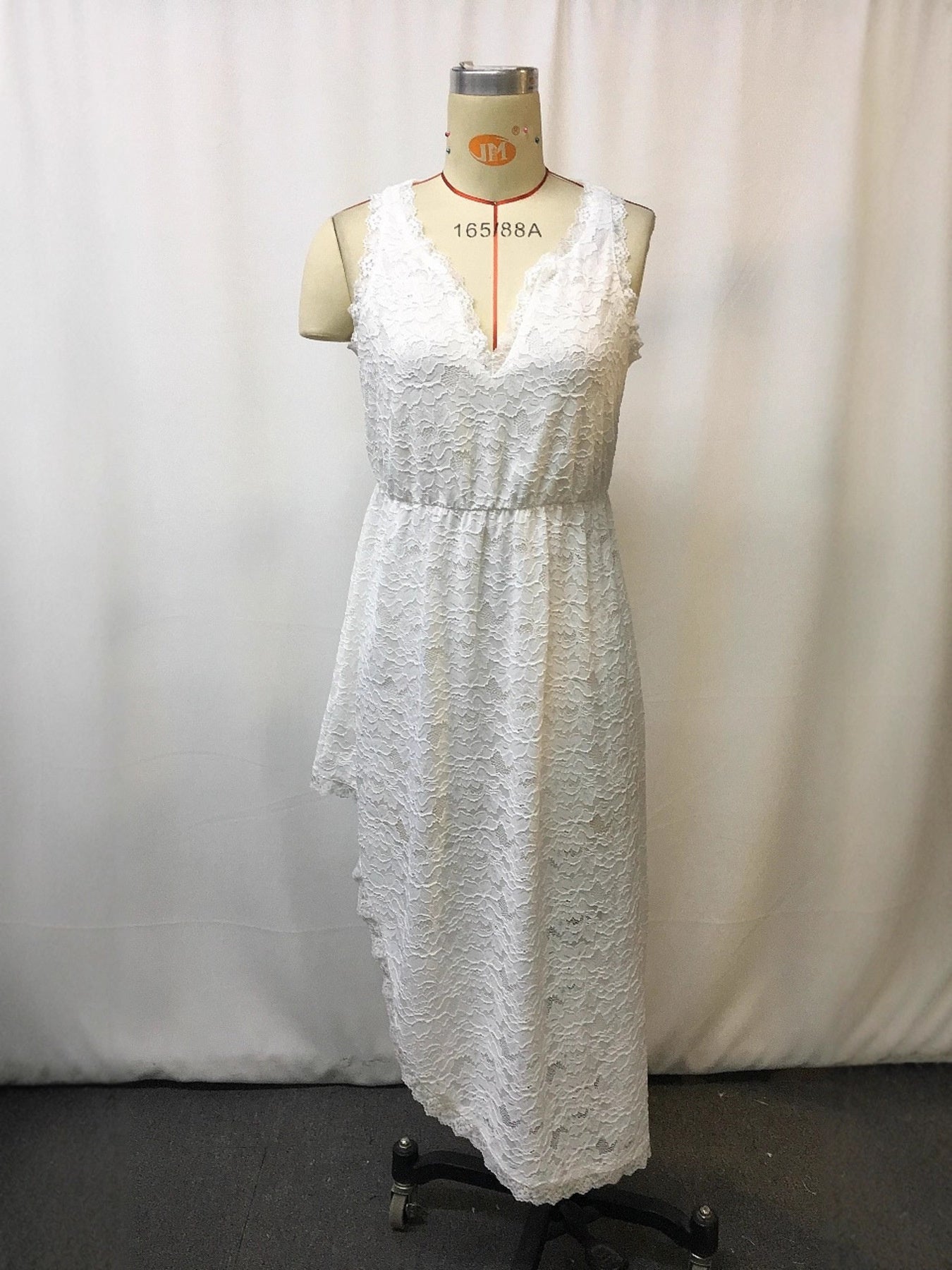 Plus size sleeveless lace dress with asymmetrical hem from Shopiebay, featuring a stylish and elegant design.
