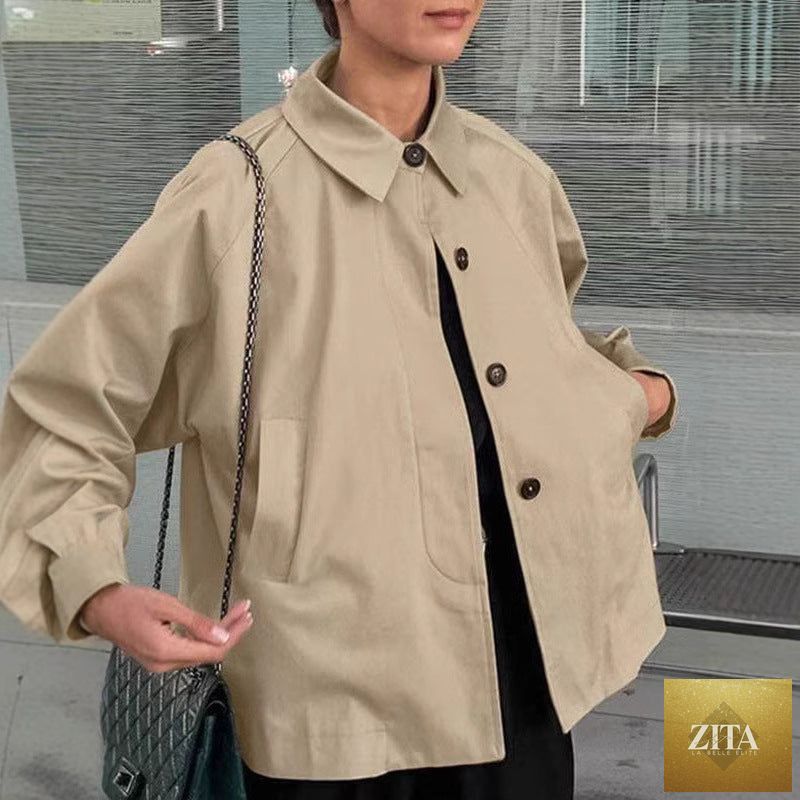 Women's French-style loose mid-length trench coat by FitiqueFit, featuring classic design and workwear chic style.