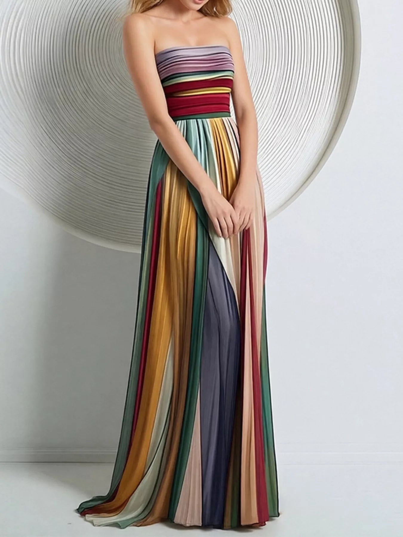Striped pleated tube maxi dress by Shopiebay featuring a fitted bodice, flowing skirt, and vibrant vertical stripes.