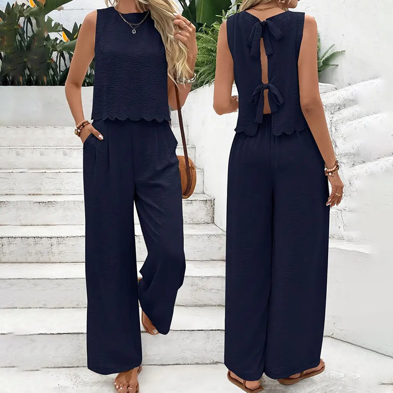 FitiqueFit elegant 2-piece matching casualwear set with sleeveless crop top and wide-leg pants, styled for a modern look.