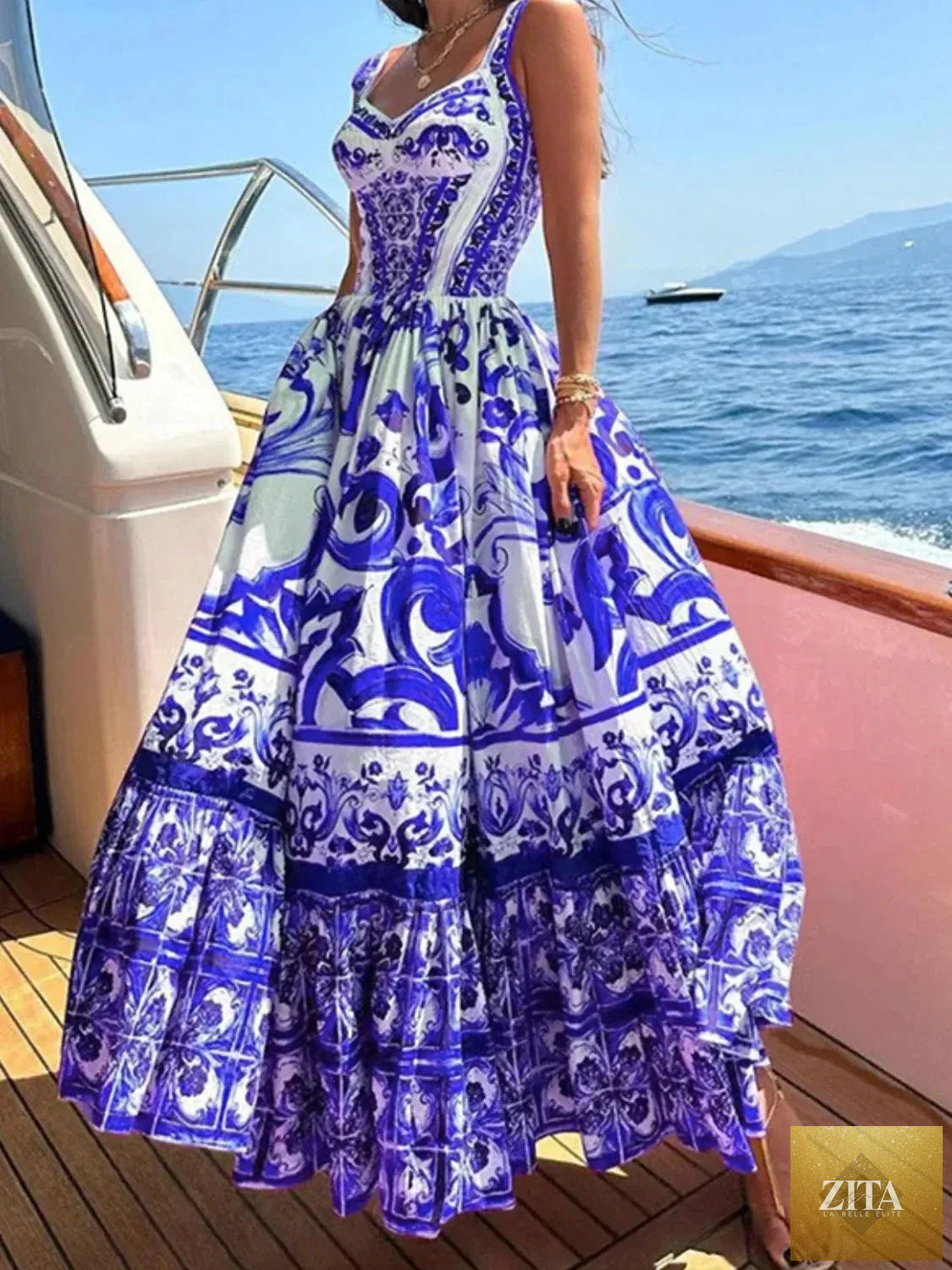 Smocked printed wide strap dress from Shopiebay featuring a flowy design and vibrant floral pattern on lightweight fabric.