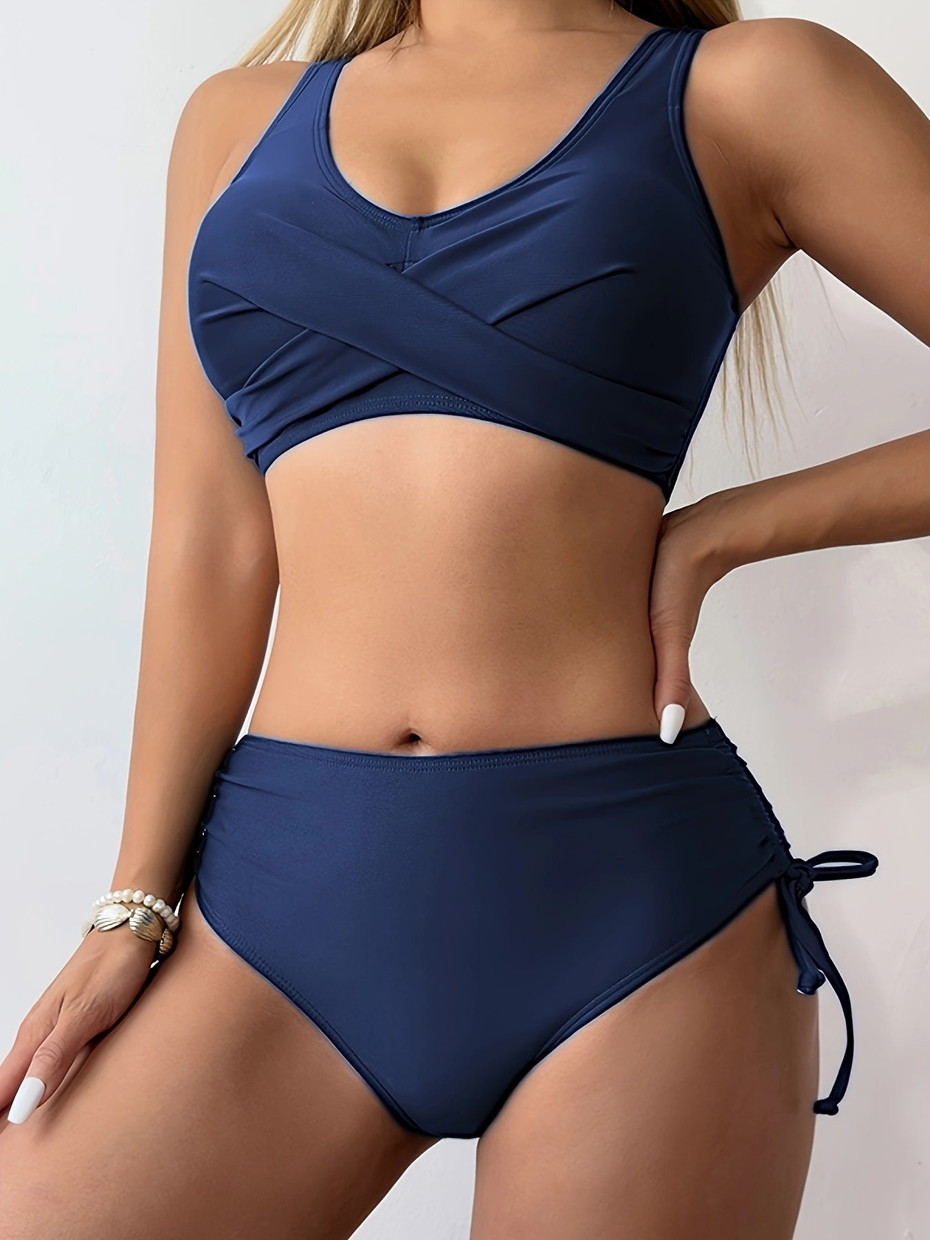Stevvex bikini set featuring twist front V-neck, high waist, and tie-back design in solid color, ideal for beach and pool days.
