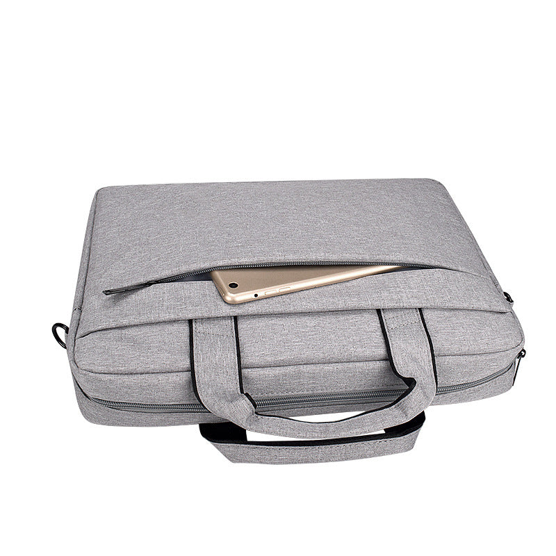 Leather laptop shoulder bag by FLIPSTYLEZLLC with adjustable strap and multiple compartments for tech and accessories.
