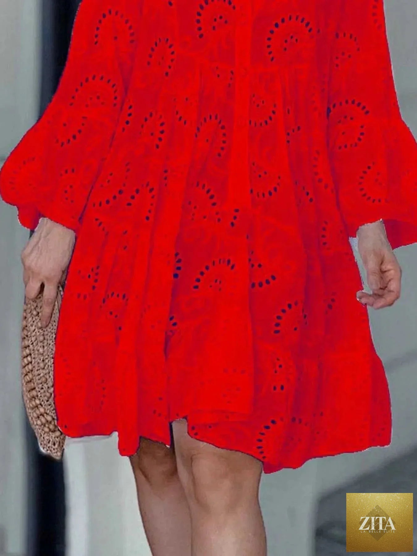 Eyelet ruffled hem tiered dress from Shopiebay featuring a flowy, layered design with eyelet details and a ruffled hem.