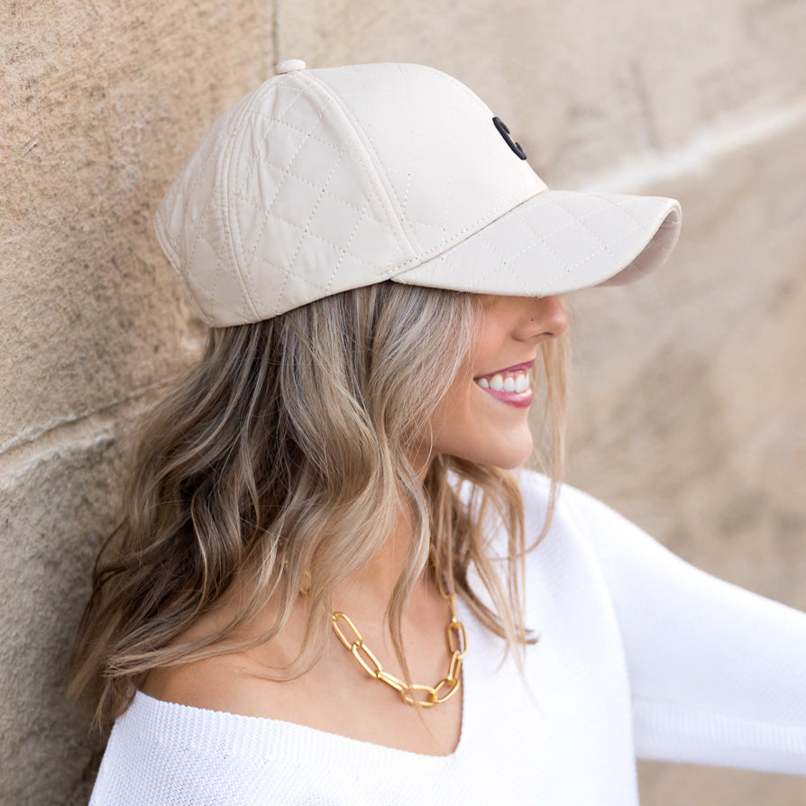 Aili's Corner quilted puffer ball cap, a stylish baseball cap with a quilted puffer design and adjustable strap.