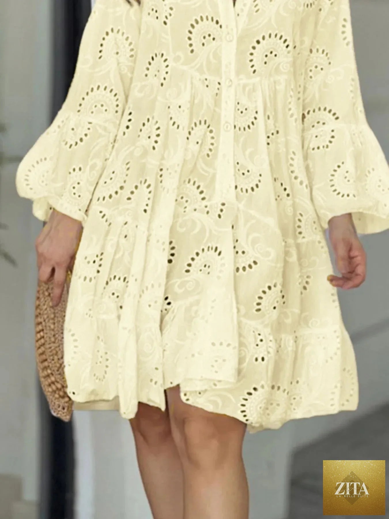 Eyelet ruffled hem tiered dress by Shopiebay featuring a flowy, layered design with eyelet detailing and ruffled accents.
