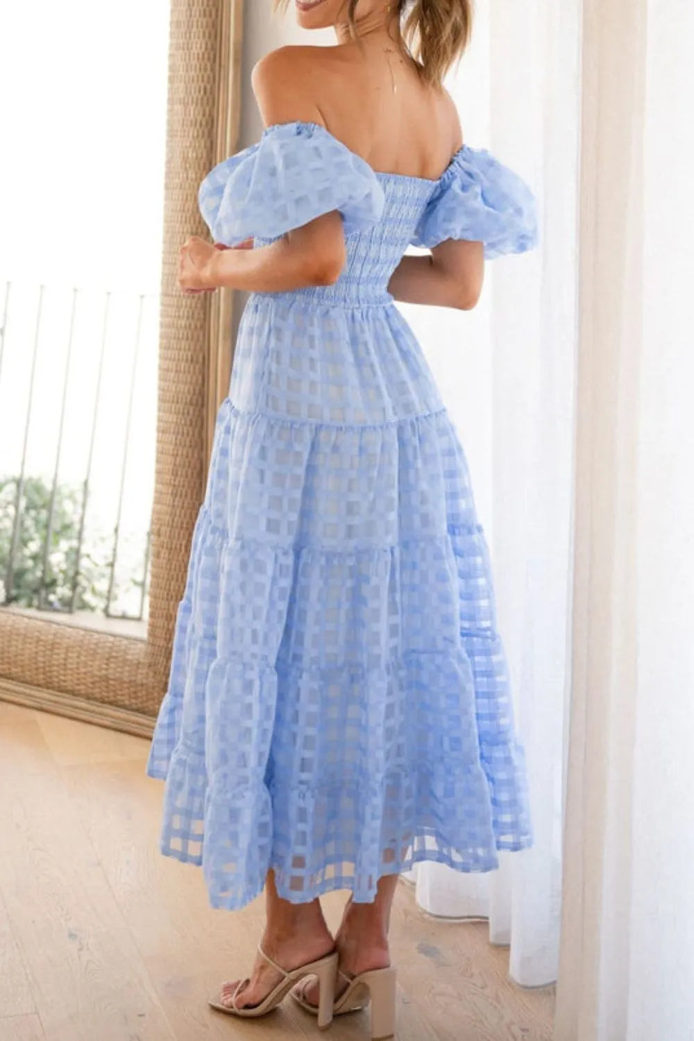 Off shoulder short puff sleeve midi dress by Shopiebay, featuring a stylish design with a fitted waist and flowing skirt.