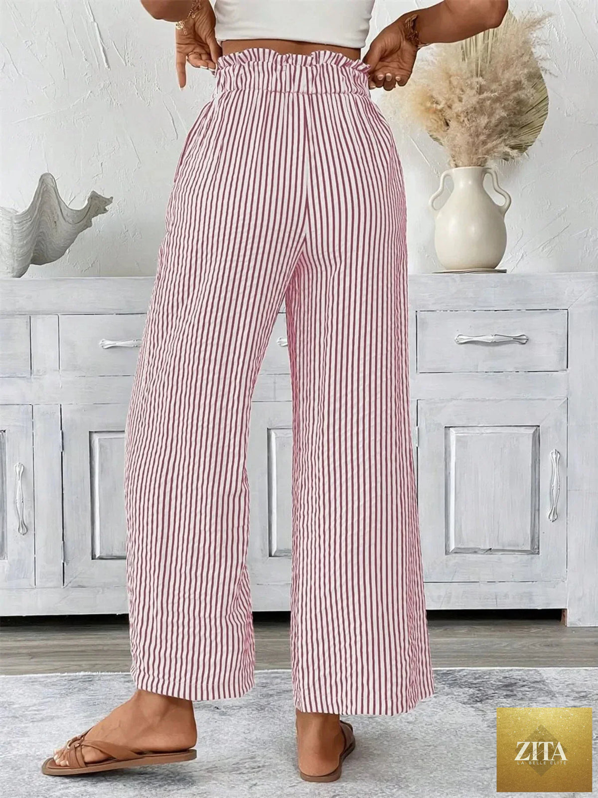 Plus size striped wide-leg paper bag pants by SITRA featuring a high waist and relaxed fit, shown in the product image.