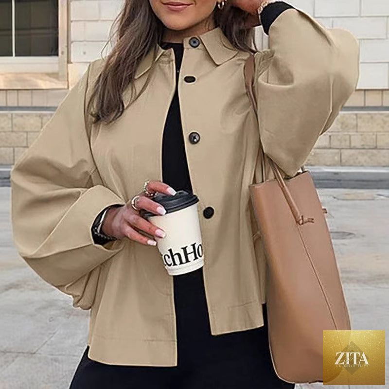 Women's FitiqueFit French-style loose mid-length trench coat, stylish workwear chic, shown hanging on a hanger.