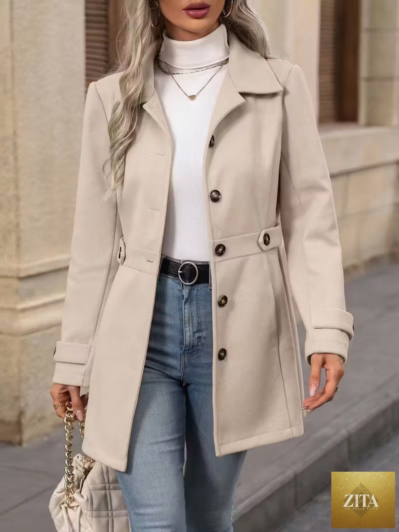 Women’s elegant woolen coat by FitiqueFit, medium-length winter coat with lapel collar and slim fit design, shown in a stylish outdoor setting.