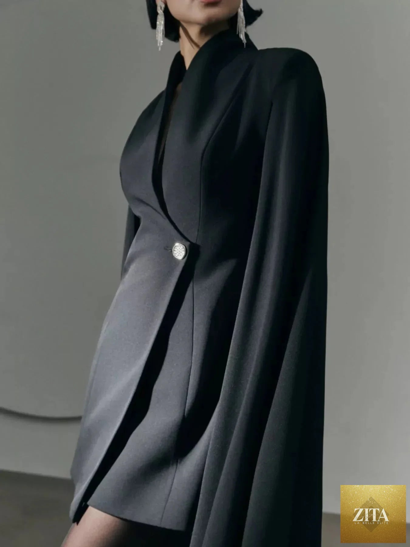 Shopiebay fitted mini blazer dress with one button closure and stylish cape sleeves, tailored for a chic, modern look.