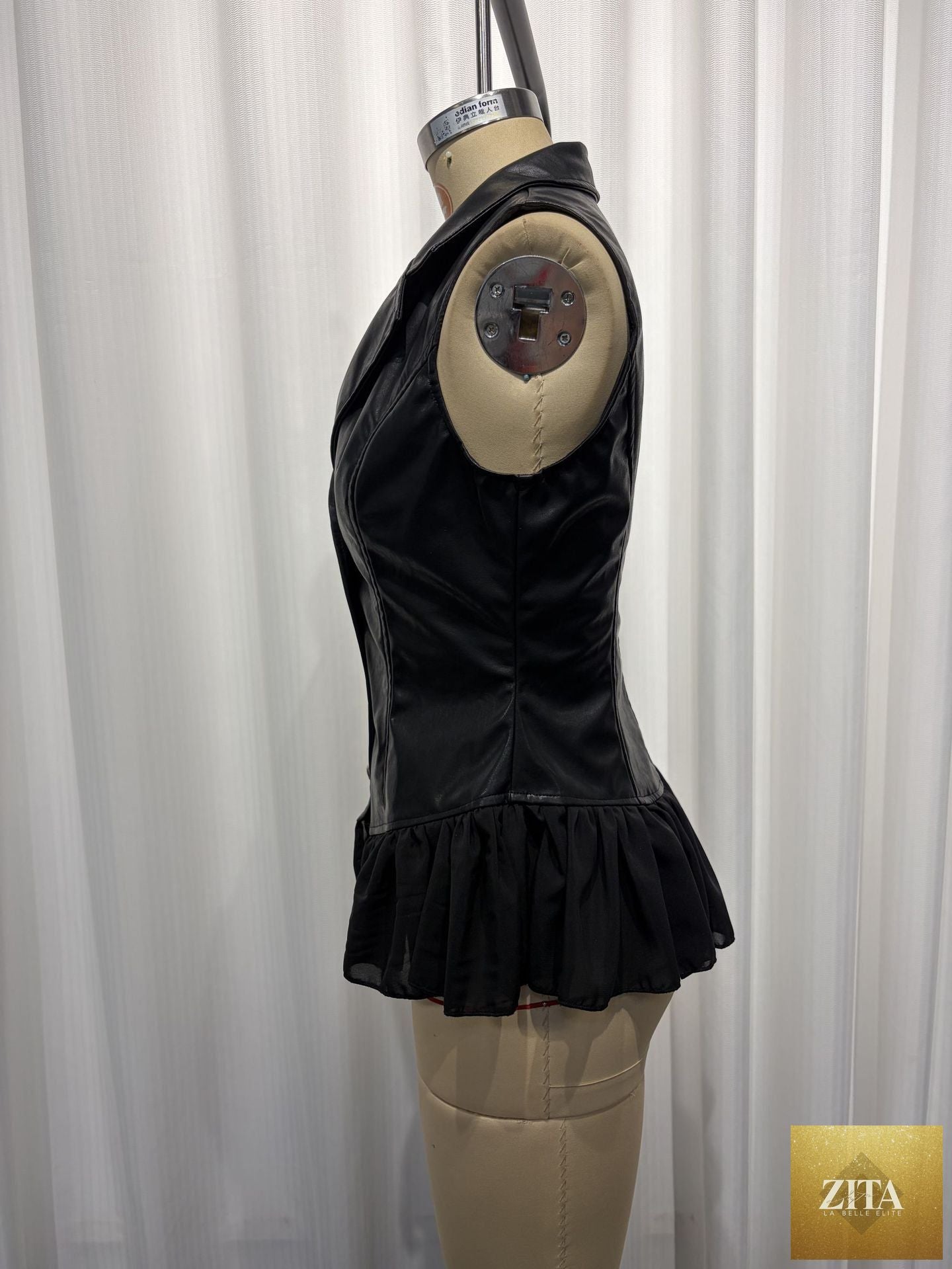 Black PU leather vest with deep V neckline, ruffle hem, fitted waist, gothic style, from FitiqueFit tops collection.