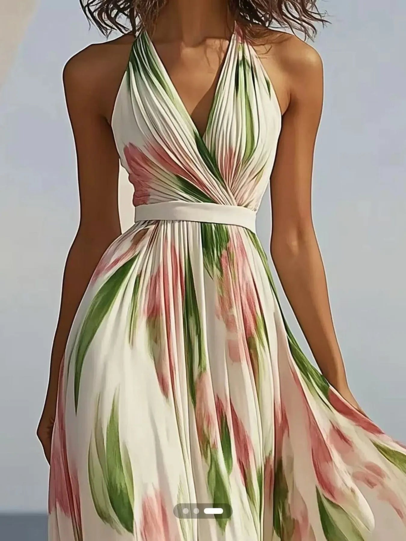Floral print halter neck maxi dress by Shopiebay featuring a flowing silhouette and vibrant flower patterns.