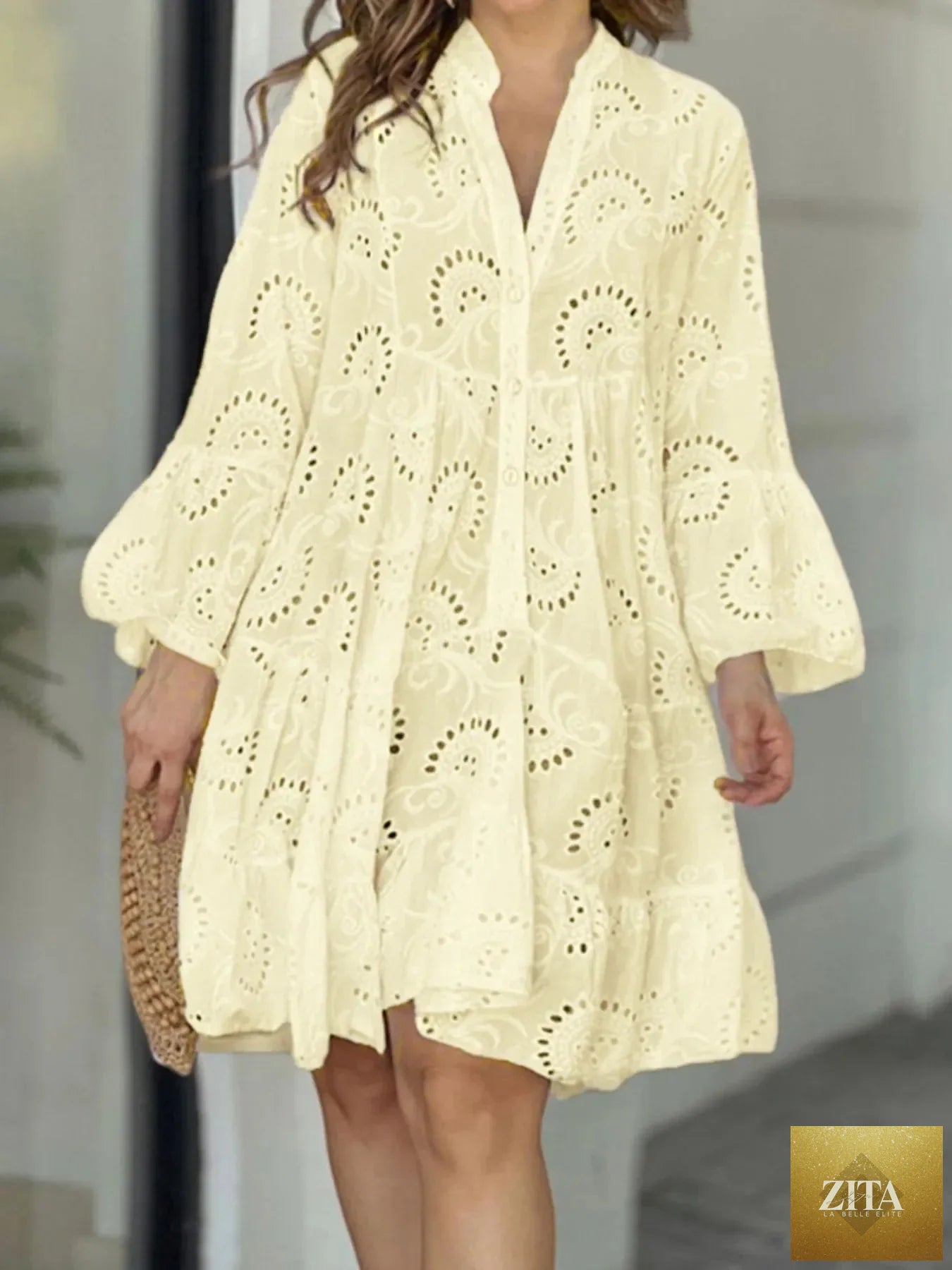 Light blue eyelet ruffled hem tiered dress from Shopiebay featuring airy layers and floral details, perfect for casual summer wear.