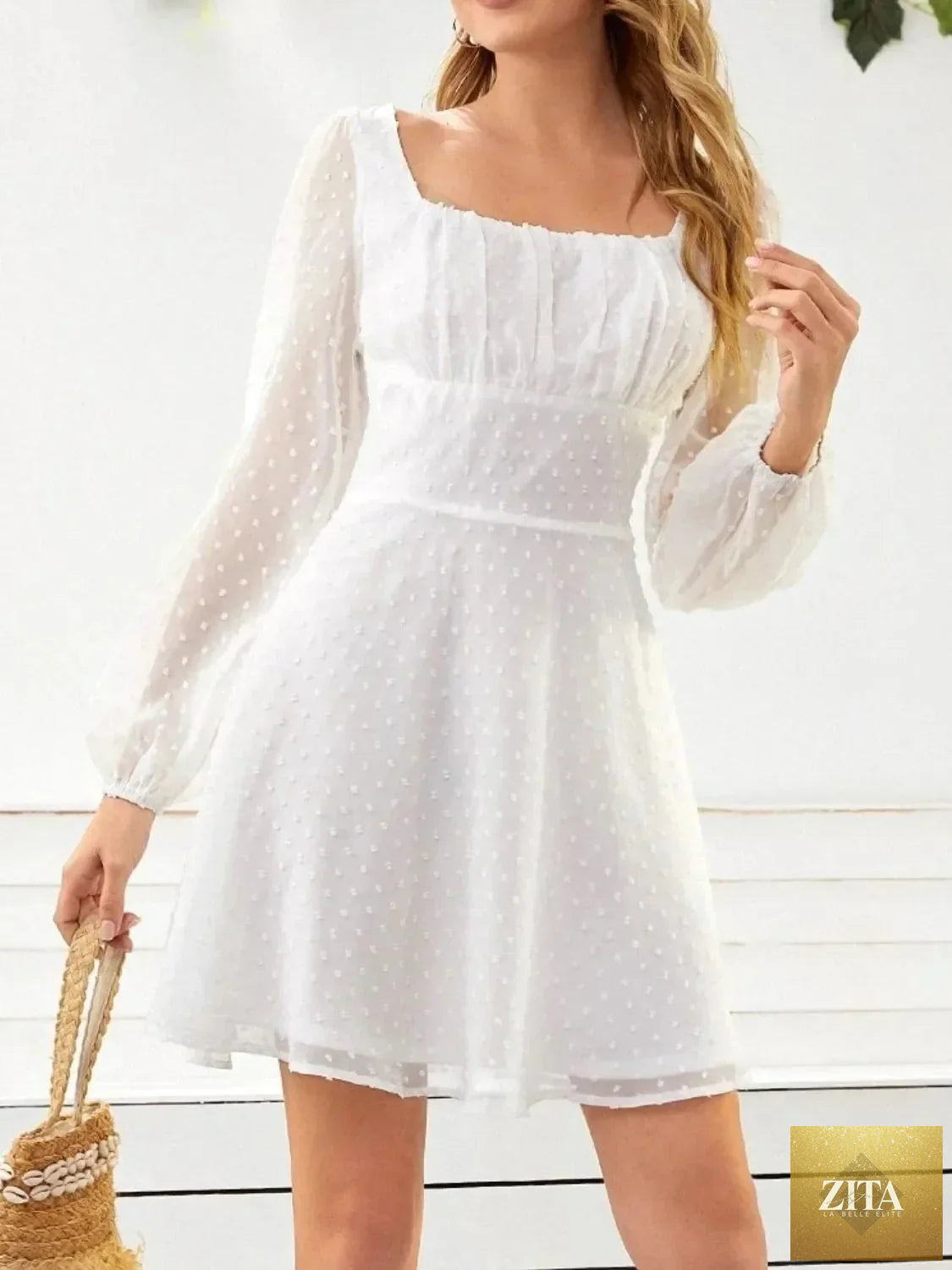 Swiss Dot long sleeve mini dress from Shopiebay featuring a feminine silhouette, delicate dot pattern, and stylish design.