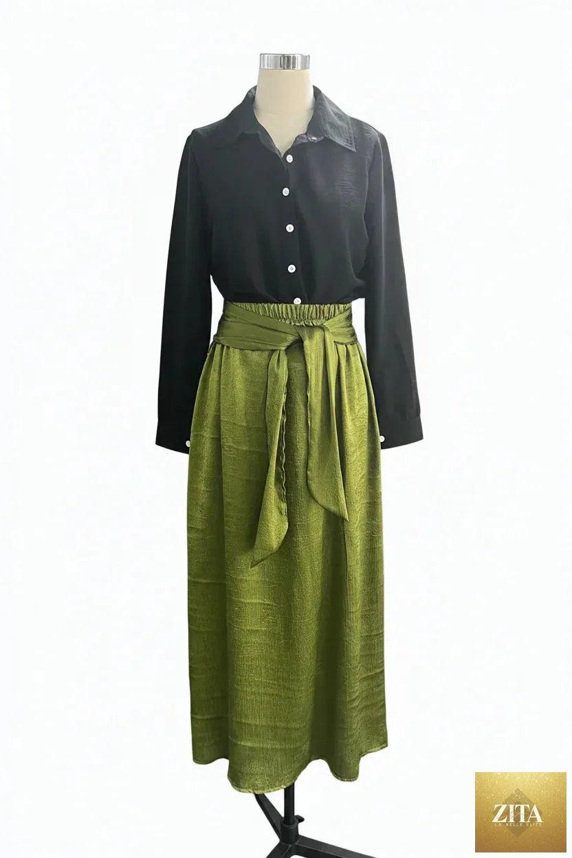 MERIDGE two-piece set with button-down shirt and high-waist tie skirt, shown on a model in a well-lit studio setting.