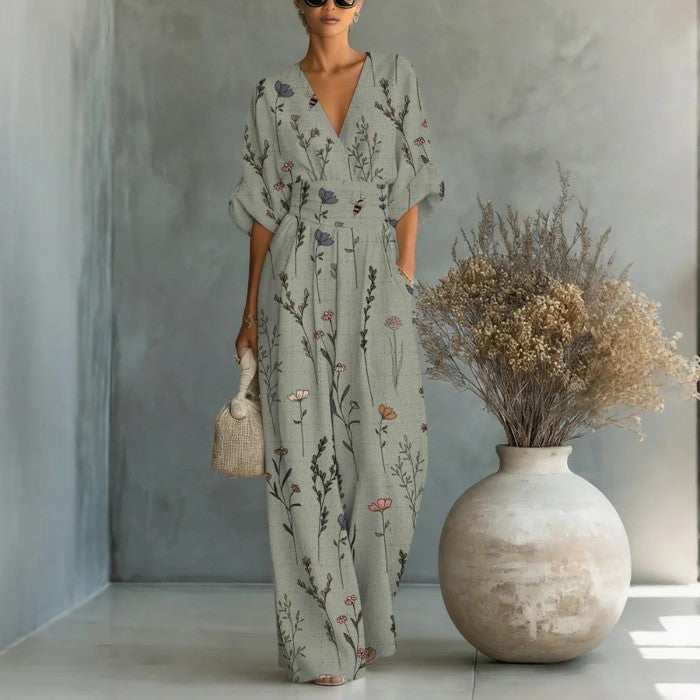 Women's waist-cinched V-neck printed wide-leg jumpsuit by FitiqueFit, featuring a stylish casualwear design with a flattering fit.