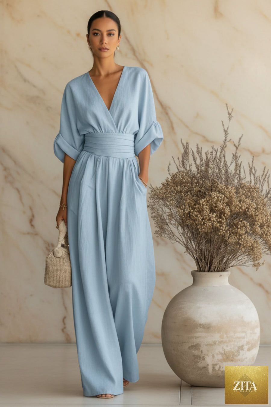 Women's V-neck wide-leg jumpsuit by MERIDGE featuring high waist and pleated design, elegant and stylish for formal or casual wear.