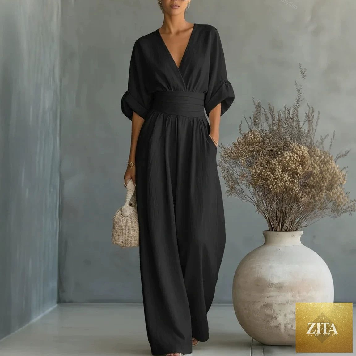 Women's MERIDGE V-neck wide-leg jumpsuit with high waist and pleated design, elegant and stylish for modern occasions.